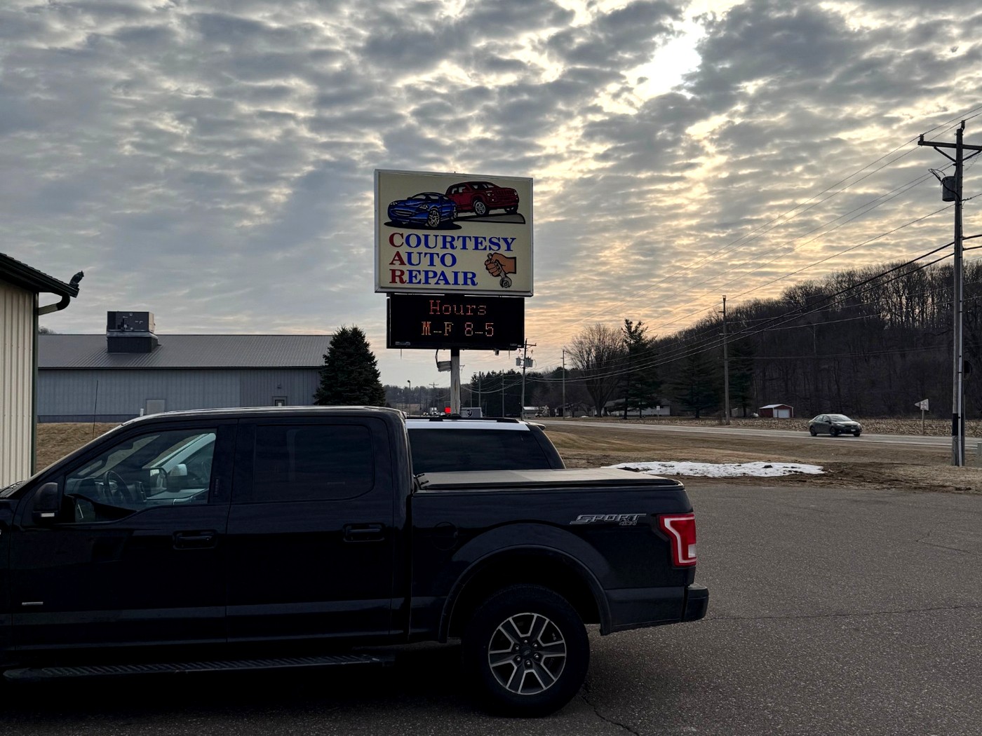 Courtesy Auto Repair roadside sign in Ellsworth